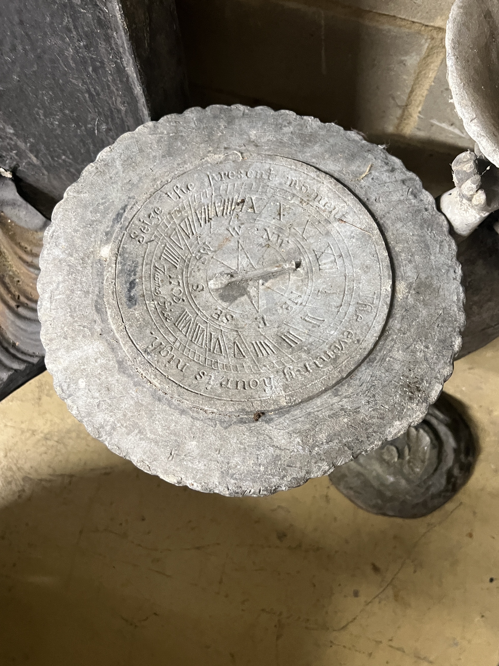 Two Victorian lead garden putto figures, one as a sundial, the other a birdbath, in need of restoration, larger height 69cm